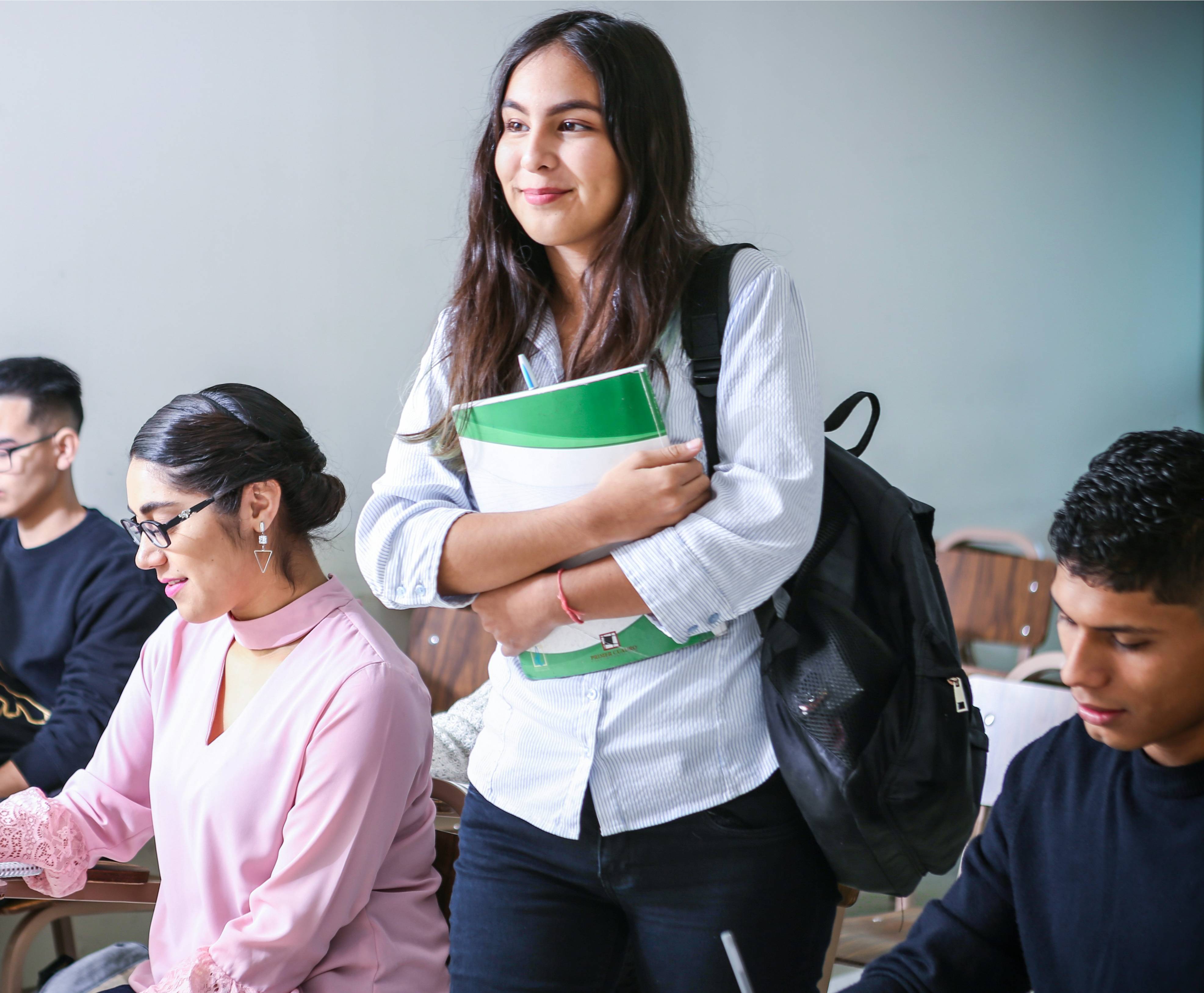 School or agency advisor discussing language programme options with a student and parent